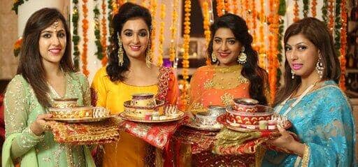 Karwa Chauth Banner image of a blog with 4 married ladies performing karwa chauth rituals.