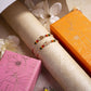 Multi-Colored Om Rakhi (Set of 2)