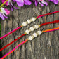 Suave Handcrafted White Beaded Rakhi (Set Of 3)